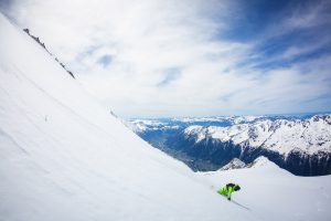 Snowboarder Riding Powder