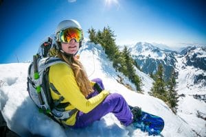 snowboarder waiting to drop into the powder
