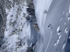 snowboarder riding powder france